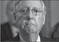  ?? The Associated Press ?? MCCONNELL: Senate Majority Leader Mitch McConnell of Ky. listens during a news conference June 27 on Capitol Hill in Washington. President Donald Trump raised the possibilit­y Thursday that McConnell should step down if he can't muscle health care and...