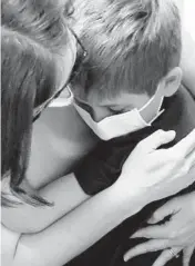  ??  ?? Gabriel Gometz, 8, is congratula­ted by his mother, Shannon Lightner-Gometz, after he received his Moderna COVID-19 vaccinatio­n during a trial at Lurie Children’s Hospital in Chicago on Aug. 27.