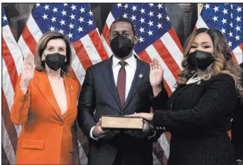  ?? Jose Luis Magana The Associated Press ?? House Speaker Nancy Pelosi, left, administer­s the oath of office to Rep. Sheila Cherfilus-mccormick, D-fla., during a ceremonial swearing-in Tuesday on Capitol Hill.