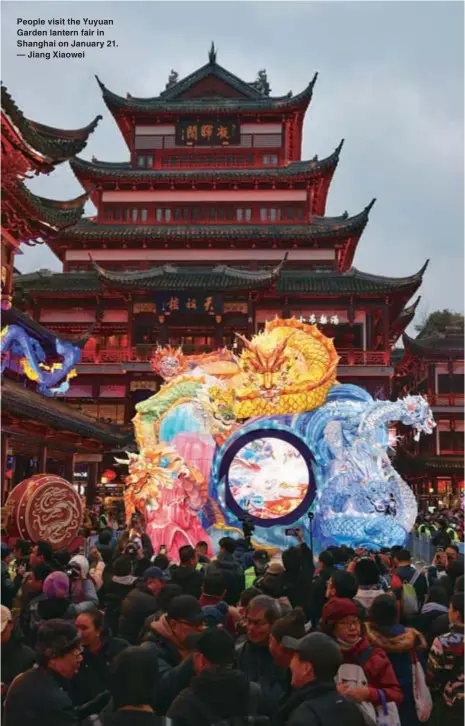  ?? ?? People visit the Yuyuan Garden lantern fair in Shanghai on January 21. — Jiang Xiaowei