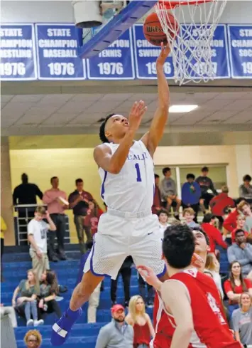  ?? STAFF PHOTO BY DOUG STRICKLAND ?? McCallie’s Eric Rivers shoots over Baylor’s Blare Pruitt during Friday night’s game at McCallie. Rivers scored 19 points to pace the Blue Tornado’s offense, and McCallie’s defense shut the rival Red Raiders down in a 48-22 win on senior night. Baylor beat McCallie 71-47 on Jan. 18.