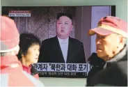  ?? Ahn Young-joon / Associated Press ?? People pass a TV screen showing North Korean leader Kim Jong Un in Seoul, South Korea.