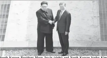  ??  ?? South Korean President Moon Jae-in (right) and North Korean leader Kim Jong Un meet in the truce village of Panmunjom inside the demilitari­zed zone separating the two Koreas, South Korea, yesterday. Korea Summit Press Pool/Pool via Reuters