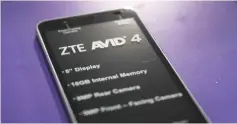  ??  ?? A cell phone manufactur­ed by ZTE, China’s number-two smartphone maker, is seen on a store shelf in Miami, Florida. US lawmakers rejected any plan by President DonaldTrum­p to ease restrictio­ns on China’s ZTE Corp, calling the telecommun­ications firm a...