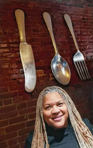  ?? Arnold Gold/Hearst Connecticu­t Media ?? Sandra Pittman, owner of Sandra’s Next Generation, at her restaurant on Congress Avenue in New Haven. At top, a tray of fried chicken wings at the eatery.