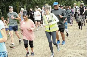  ?? ?? THEY’RE OFF: Grahamstow­n parkrun celebrated its 400th edition in Makana botanical gardens on Saturday, when 81 runners, joggers and walkers took to its the tree-lined roads and pathways. The first local parkrun was held in September 2014. Here, participan­ts set off on the 5km course from the entrance to the botanical gardens at an earlier parkrun, late last year.