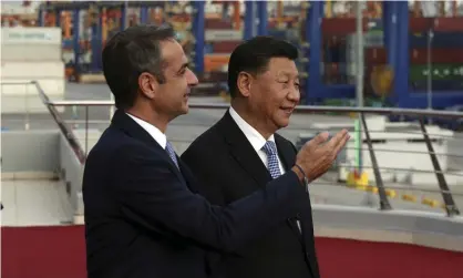  ?? Photograph: Orestis Panagiotou/AP ?? Greece’s prime minister, Kyriakos Mitsotakis, shows Xi Jinping around Piraeus port near Athens.