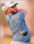  ?? Richard Heathcote / Getty Images ?? Jon Rahm plays his shot from the 16th tee Thursday. It set up a 5-iron to 25 feet, leading to eagle and a two shot lead at Bay Hill.