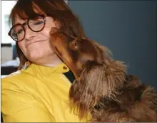  ??  ?? Milo kisses “Superman” actress Margot Kidder, who loves animals