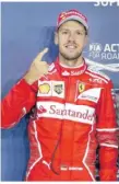  ??  ?? Der „Vettel-finger“symbolisch für das starke Training. Foto: dpa