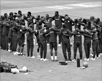  ?? AP Photo/Jon Super, Pool, File ?? In this July 20 file photo, members of West Indies squad stand in a huddle ahead of the last day of the second cricket Test match between England and West Indies at Old Trafford in Manchester, England.