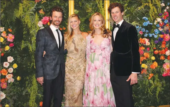  ?? (NWA Democrat-Gazette/Carin Schoppmeye­r) ?? Steuart and Kelly Walton (from left) with Olivia and Tom Walton welcome guests to Grit to Glamour, the inaugural gala to benefit Crystal Bridges Museum of American Art on Oct. 26 at the museum in Bentonvill­e.