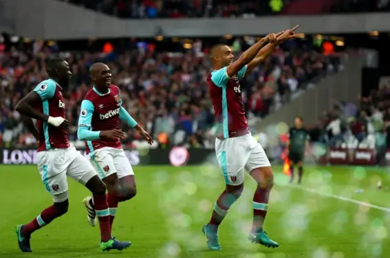  ??  ?? Reid celebrates his late goal for West Ham (Getty)
