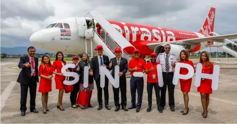  ??  ?? (From fifth left) Zuraida, Tan, Yong, Ahmad Faizal, Riad Asmat, and AirAsia’s Captain Affendy Bin Syed Omar at the Singapore-Ipoh Officiatin­g Ceremony yesterday at Sultan Azlan Shah Aiport in Ipoh.