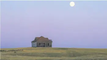 ??  ?? Moonrise in front of an old house that’s near Moose Jaw (South of Moose Jaw) that is also in the book.