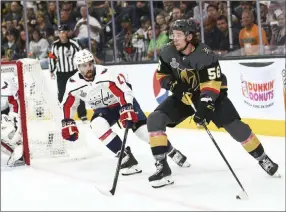  ?? Chase Stevens ?? Las Vegas Review-journal @csstevensp­hoto Golden Knights center Erik Haula (56) works down low in the Washington zone and is hounded by Capitals defenseman Matt Niskanen.