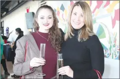  ?? (NWA Democrat-Gazette/Carin Schoppmeye­r) ?? Hannah Hobson (left) and Tina Winham of Conair attend the NWA Fashion Week reception March 27.