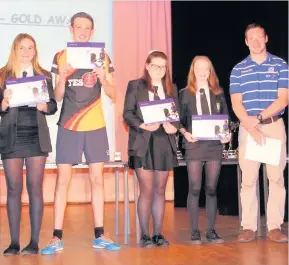  ??  ?? Pictured with Scott Riddell, captain of Scotland’s national sevens team, are some of the McLaren High pupils awarded sports leader gold awards at their inaugural Sports Award Ceremony. More than 130 pupils attended the event.