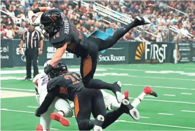  ?? PHOTOS BY ROB SCHUMACHER/THE REPUBLIC ?? Rattlers wide receiver Jarrod Harrington dives into the end zone for a touchdown against the Sioux Falls Storm in the first half during the United Bowl on Saturday night at Gila River Arena.