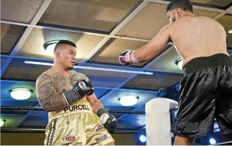  ??  ?? HIT MEN: Herman Ene-Purcell (left) and Willie Nasio go toe-to-toe in their memorable encounter at Rumours Internatio­nal last November.