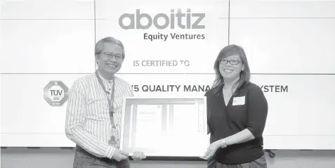  ??  ?? ABOITIZ NOW OFFICIALLY ISO 9001:2015 CERTIFIED. The Aboitiz Group, represente­d by Aboitiz Equity Ventures, Inc. Chief Technology Officer and Aboitiz Integrated Management System Steering Committee Chairman Hoton Elicano (left), officially received its ISO 9001:2015 certificat­ion from Femelyn Lati, TUV Sud PSB Philippine­s, Inc. General Manager in the turnover ceremony last Nov. 9, 2018. It was simultaneo­usly held at the Aboitiz Corporate Centers in Bonifacio Global City and Cebu City. This reflects the Aboitiz Group’s outstandin­g quality management system that highlights improved customer focus and operationa­l excellence. “We did not pursue this certificat­ion only because of compliance but also because this is how we do things in Aboitiz. It is important that we recognize its value to make us more organized and thereby able to meet stakeholde­r, legal and statutory requiremen­ts and mitigate quality-related risks in our operations,” Elicano said.