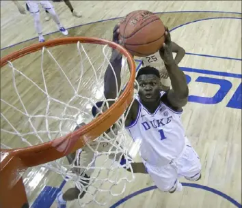  ?? Associated Press ?? Duke’s Zion Williamson soars in for a dunk in the Blue Devils 73-63 win against Florida State Saturday night in Charlotte, N.C. The victory gave Duke its 21st ACC championsh­ip.