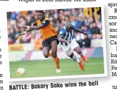  ??  ?? the ball BATTLE: Bakary Sako wins