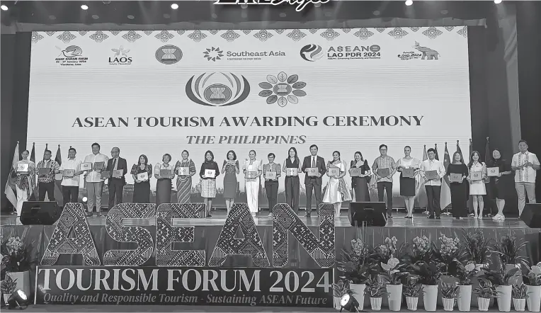  ?? ?? DOT Secretary Christina Garcia Frasco with the Philippine recipients of the 2024 ASEAN Tourism Standard Awards
