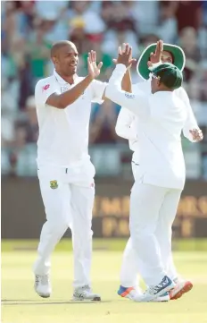  ?? — AFP ?? South African bowler Vernon Philander (left) celebrates the dismissal of Sri Lanka batsman Suranga Lakmal (not in picture) during the second Test at Newlands Cricket Stadium in Cape Town.