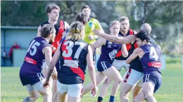  ??  ?? Catani’s Nathaniel Rodda lay a strong tackle on Nilma-Darnum’s Christophe­r Larosa.