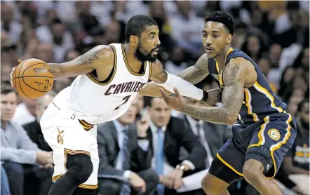  ?? TONY DEJAK/THE ASSOCIATED PRESS ?? The Cavaliers’ Kyrie Irving, left, drives past the Pacers’ Jeff Teague on Monday during Game 2 of the first round of the NBA Playoffs in Cleveland. The Cavaliers won, 117-111 and took a 2-0 series lead.