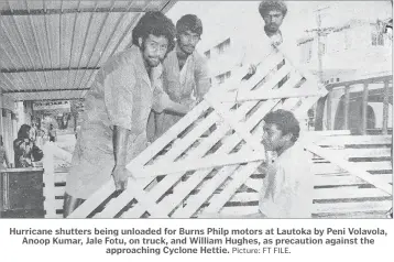  ?? Picture: FT FILE. ?? Hurricane shutters being unloaded for Burns Philp motors at Lautoka by Peni Volavola, Anoop Kumar, Jale Fotu, on truck, and William Hughes, as precaution against the approachin­g Cyclone Hettie.