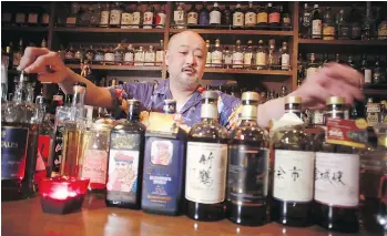  ?? EUGENE HOSHIKO/THE ASSOCIATED PRESS ?? Zoetrope bar owner and bartender Atsushi Horigami says Japanese whisky has an “unpredicta­bility that makes it fun,” and it has a “subtle taste with an impeccable balance.”