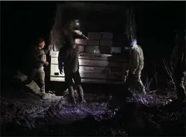  ?? TYLER HICKS — THE NEW YORK TIMES ?? Ukrainian forces receive a delivery of artillery shells near the Kupiansk front line on Nov. 17. With current funding nearly exhausted, American officials have said they are scrambling to find ways to provide aid for Ukraine, which is continuing its war against Russia.