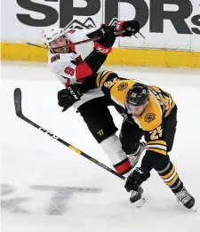  ?? STUART CAHILL / HERALD STAFF FILE ?? THROWING HIS WEIGHT AROUND: Brandon Carlo delivers a hit on Ottawa’s Bobby Ryan during the 201819 season.