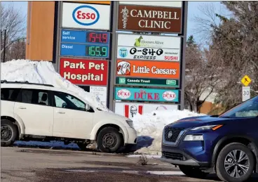  ?? HERALD PHOTO BY AL BEEBER ?? Gasoline prices are seen at the Esso station along Columbia Boulevard on Wednesday morning. Fuel prices have increased at some city stations before the planned April 1 increase in the Alberta fuel tax and the carbon tax.