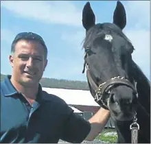  ?? PHOTO PROVIDED ?? Pink Sheet handicappe­r, and thoroughbr­ed owner, Dan Feiss, right, Feiss’ horse Looky There and brother Jim Feiss together in Pennsylvan­ia in 2011.