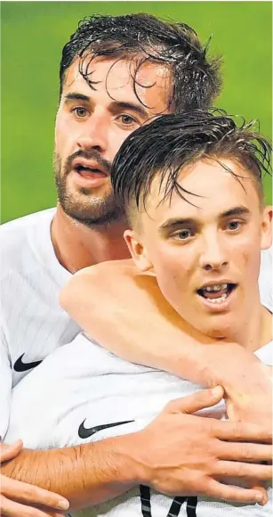  ??  ?? All Whites midfielder Ryan Thomas celebrates after scoring the first of his