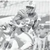  ?? AL DIAZ/MIAMI HEARALD ?? Miami running back Cam’Ron Harris races to a touchdown Saturday against Pittsburgh at Hard Rock Stadium.