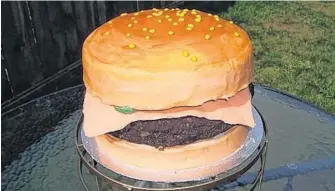  ?? CONTRIBUTE­D ?? Lisa Bowen Ings of Sugar Rush - Unique Custom Cakes in St. John's, N.L. says there is a wealth of informatio­n on the Internet on how to sculpt cakes to have them look like other food items, like she did with this cake that looks like a hamburger.