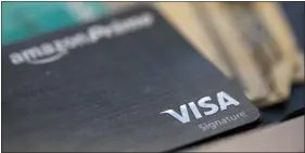  ?? JENNY KANE — THE ASSOCIATED PRESS FILE ?? The Visa logo is seen on a credit card in New Orleans in August 2019.