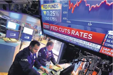  ?? RICHARD DREW/ASSOCIATED PRESS ?? A television screen on the floor of the New York Stock Exchange shows the most recent rate decision of the Federal Reserve Wednesday.