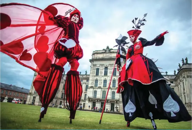  ??  ?? Dancers of the Art Tremendo dance company perform in front of the Ludwigslus­tís castle, northern Germany, during an event to promote the ‘Small festival in a big park’ festival to be held on August 10 and 11. — AFP