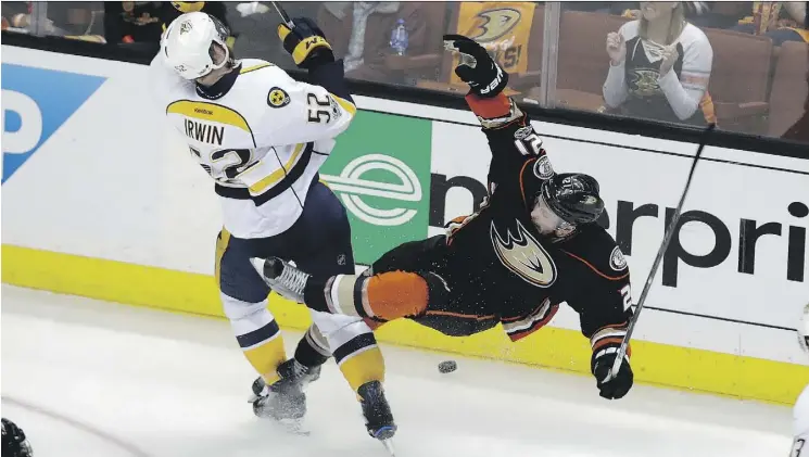  ?? CHRIS CARLSON/THE ASSOCIATED PRESS ?? Nashville Predators defenceman Matt Irwin, left, collides with Anaheim Ducks forward Chris Wagner in Game 2 on Sunday in Anaheim, Calif.