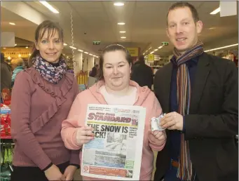  ??  ?? In Wallaces SuperValu Wellington­bridge were Mary Culleton, store mananger; Caoimhe Aspel Foulksmill­s winner €20 and David Looby, New Ross Standard.