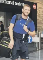  ??  ?? 0 Russell arrives in Auckland yesterday to join the British and Irish Lions tour.