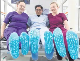  ?? (Pic: Darragh Kane) ?? Mercy University Hospital Cork’s Emergency Department has introduced anti-slip “grippy socks”, funded by the Mercy University Hospital Foundation, in a move that aims to mitigate the risk of slips, trips and falls for patients. Pictured promoting their use are Kelly Magee, healthcare assistant MUH; Nisha Nair, staff nurse ED and Deirdre Kearney, team occupation­al therapist.