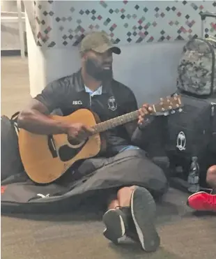  ?? Photo: FRU Media ?? Fiji Airways Fijian 7s star rep Semi Radradra plays his guitar at their base in San Francisco on July 18, 2018.