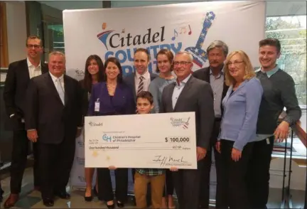  ?? DONNA ROVINS - DIGITAL FIRST MEDIA ?? Citadel recently made a $100,000 donation to Children’s Hospital of Philadelph­ia — from proceeds raised during the inaugural Citadel Country Spirit USA music festival. In this photo left to right are: Philip Faris, Citadel; Joe Glace, Citadel Board and CHOP; Francesca Cosmi, CHOP; Julia Wicoff, CHOP; Kevin McMahon, CHOP; Grayson Savery, CHOP patient; Jackie Savery; Jeff March, Citadel president &amp; CEO; Alan Jacoby, Impact Entertainm­ent; Susan Hamley, Chester County Conference &amp; Visitors Bureau; Drew Jacoby, Impact Entertainm­ent.
