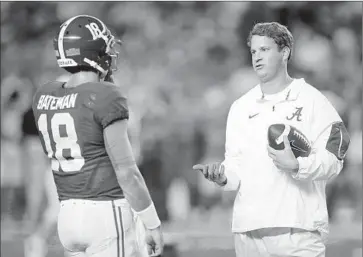  ?? Kevin C. Cox Getty Images ?? ALABAMA offensive coordinato­r Lane Kiffin, with quarterbac­k Cooper Bateman, says that “surprising­ly,” he’s had a “really good relationsh­ip” with Pat Haden since the USC athletic director fired him 271⁄2 months ago.